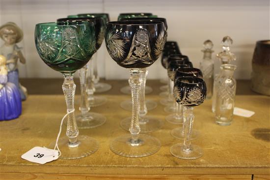 Bohemian part suite of harlequin table glass (16-pce) and three toilet bottles (one lacking stopper)